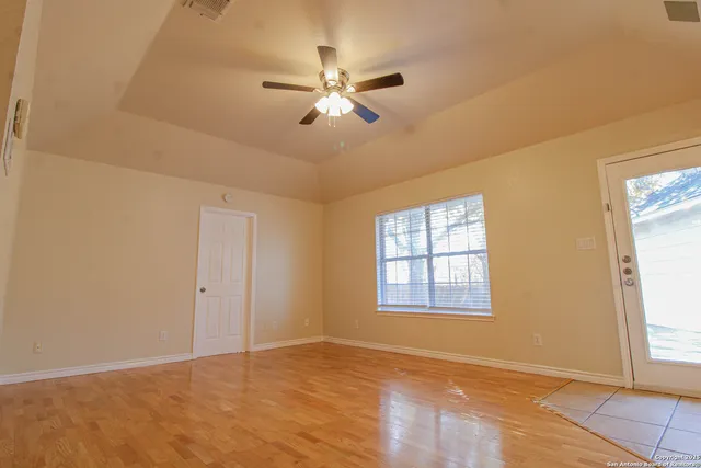a view of an empty room with a window