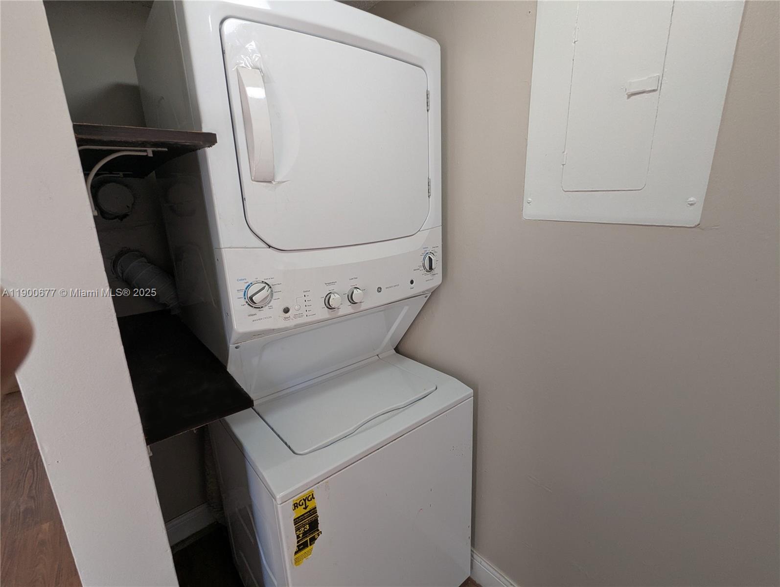 3400 Foxcroft Road, Unit 115 Miramar, FL 33025 - Photo 16 of 16 a utility room with dryer and washer