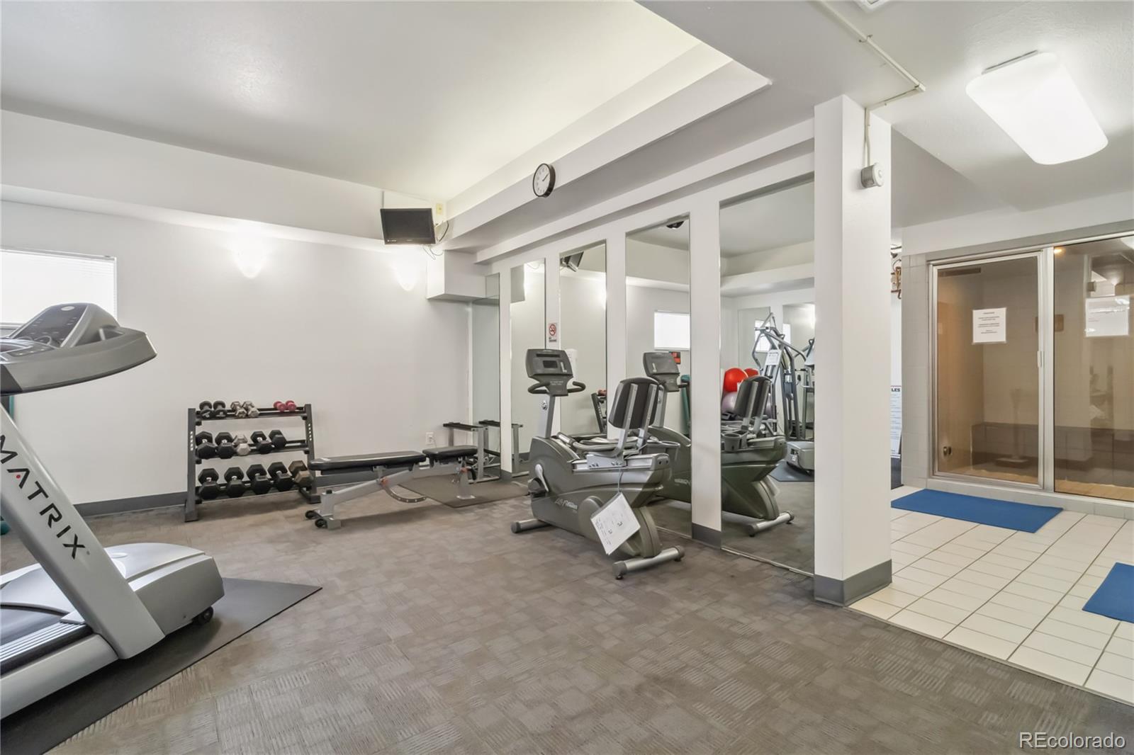 7040 East Girard Avenue, Unit E406 Denver, CO 80224 - Photo 25 of 27 a view of a room with gym equipment