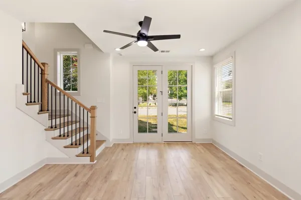 wooden floor in an empty room with a window