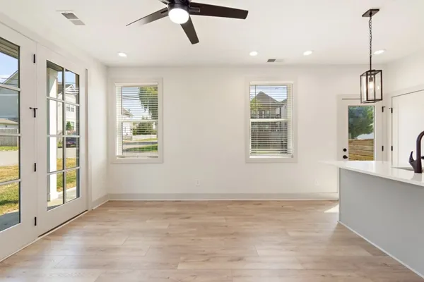 a view of an empty room with a window