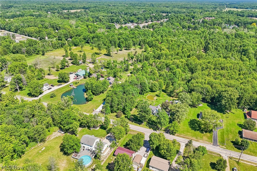 2960 Rome Rock Creek Road Rock Creek, OH 44084 - Photo 9 of 49 Expansive aerial view showcasing a large residential property with a private pond and surrounding mature trees