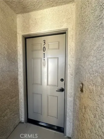 a kitchen with white cabinets and a sink