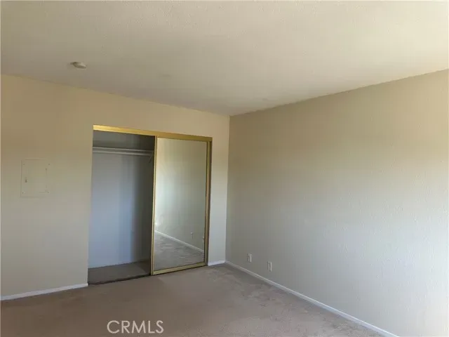 a bathroom with a granite countertop sink mirror and vanity