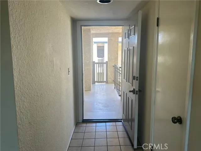 a kitchen with granite countertop white cabinets and stainless steel appliances