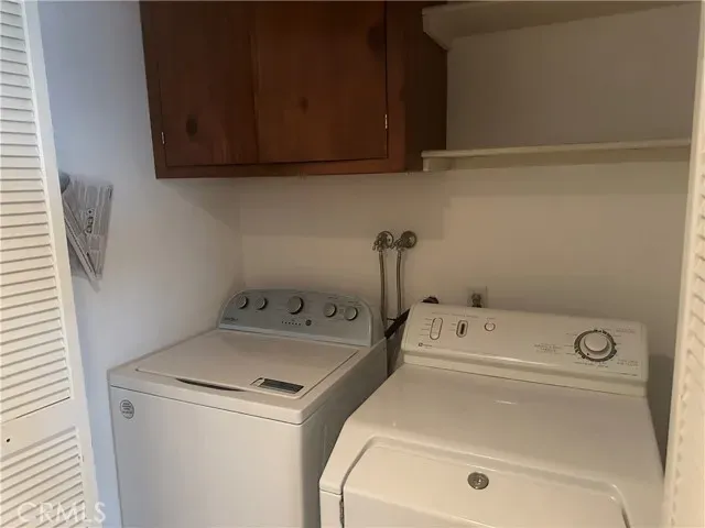 a view of an empty room with a fireplace