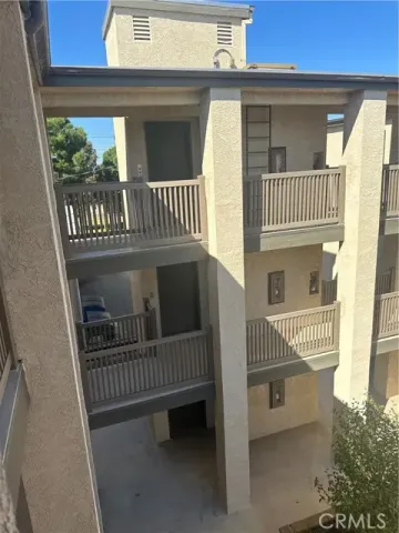 a view of parking garage with cars parked