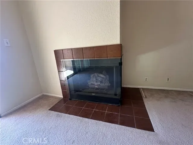 a view of a balcony with wooden floor