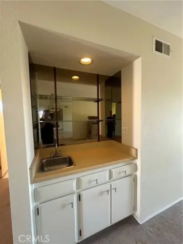 a view of a balcony with wooden floor