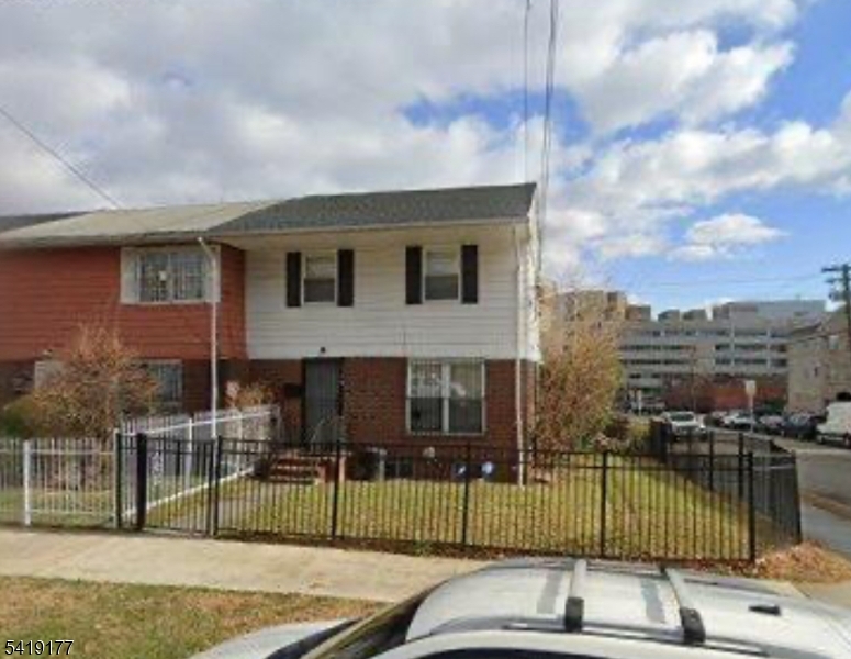 170 Fairmount Avenue Newark, NJ 07103 - Photo 1 of 8 a front view of a house with swimming pool