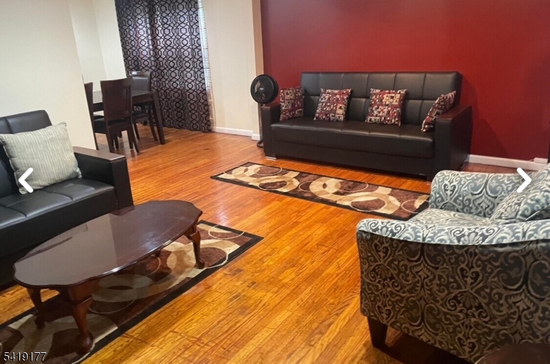 170 Fairmount Avenue Newark, NJ 07103 - Photo 2 of 8 a living room with furniture and a rug