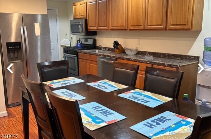170 Fairmount Avenue Newark, NJ 07103 - Photo 4 of 8 a kitchen with stainless steel appliances granite countertop a refrigerator a stove top oven a sink and dishwasher