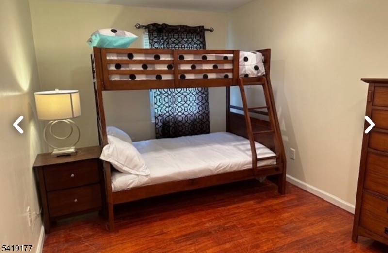 170 Fairmount Avenue Newark, NJ 07103 - Photo 6 of 8 a bedroom with a bed and a dresser