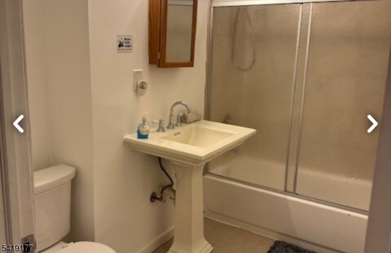 170 Fairmount Avenue Newark, NJ 07103 - Photo 8 of 8 a bathroom with a sink a toilet and shower