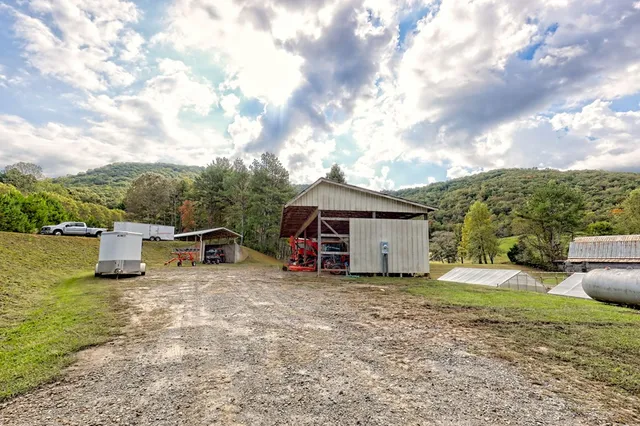 an aerial view of a house with backyard