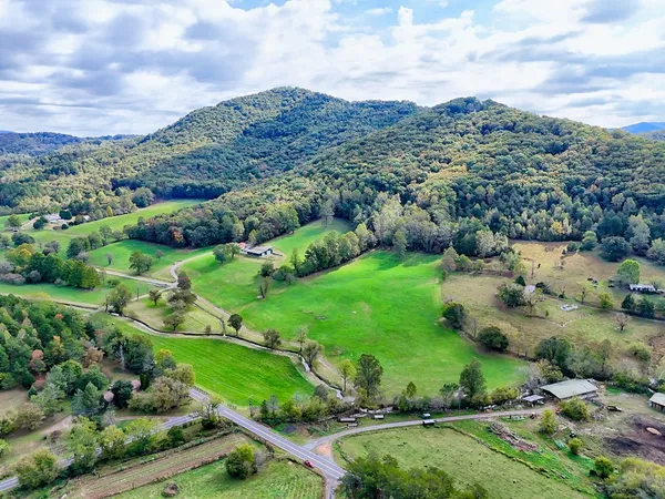 a view of an entryway with wooden floor and door