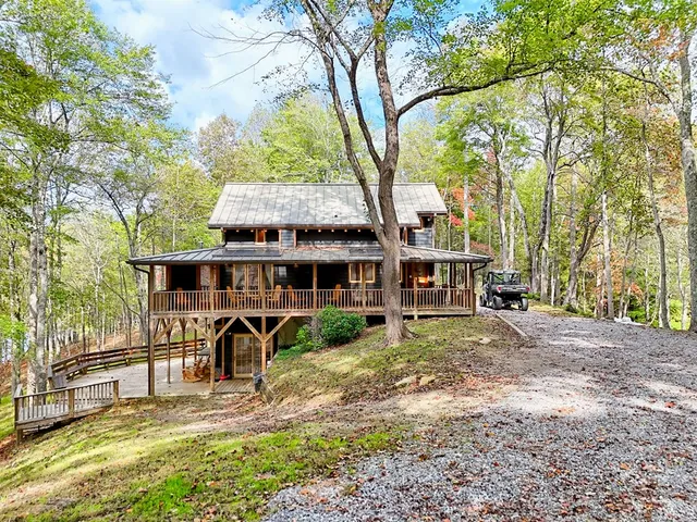 a bedroom with bed and wooden floor