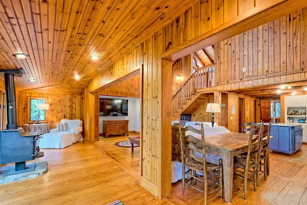 a large kitchen with stainless steel appliances granite countertop a stove a sink dishwasher and a refrigerator