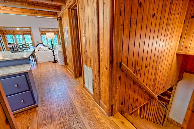 a view of a house with a wooden fence