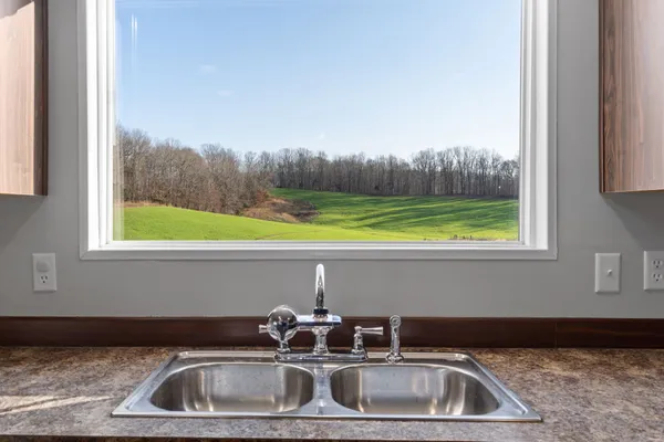 a bathroom with a sink and a window