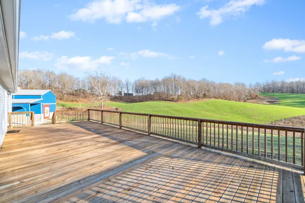 a view of a terrace with yard and lake view