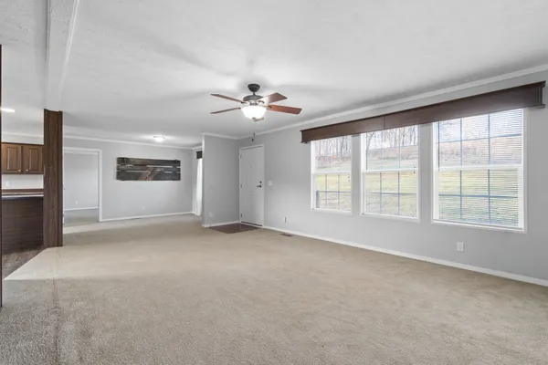 a view of an empty room with a window