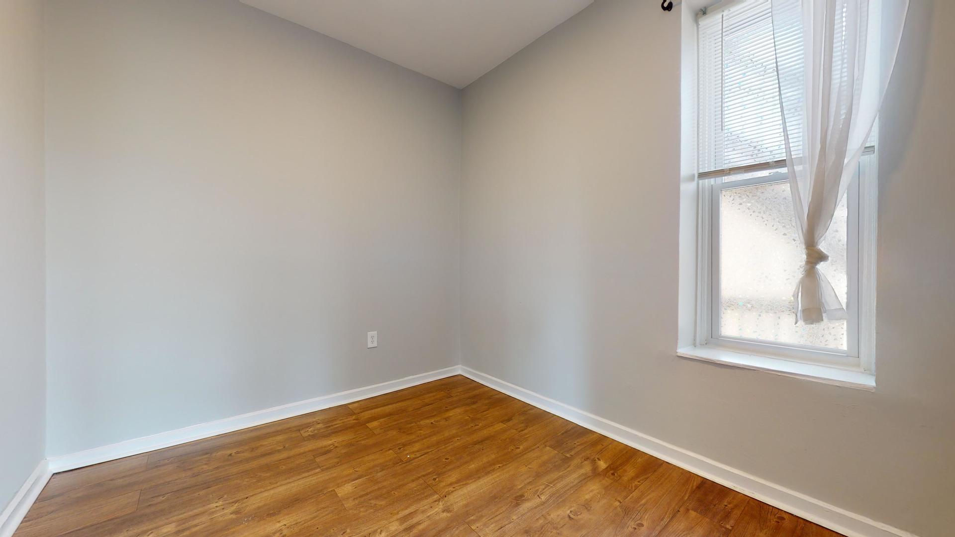 2700 West Cermak Road, Unit 2R Chicago, IL 60608 - Photo 11 of 15 an empty room with a window