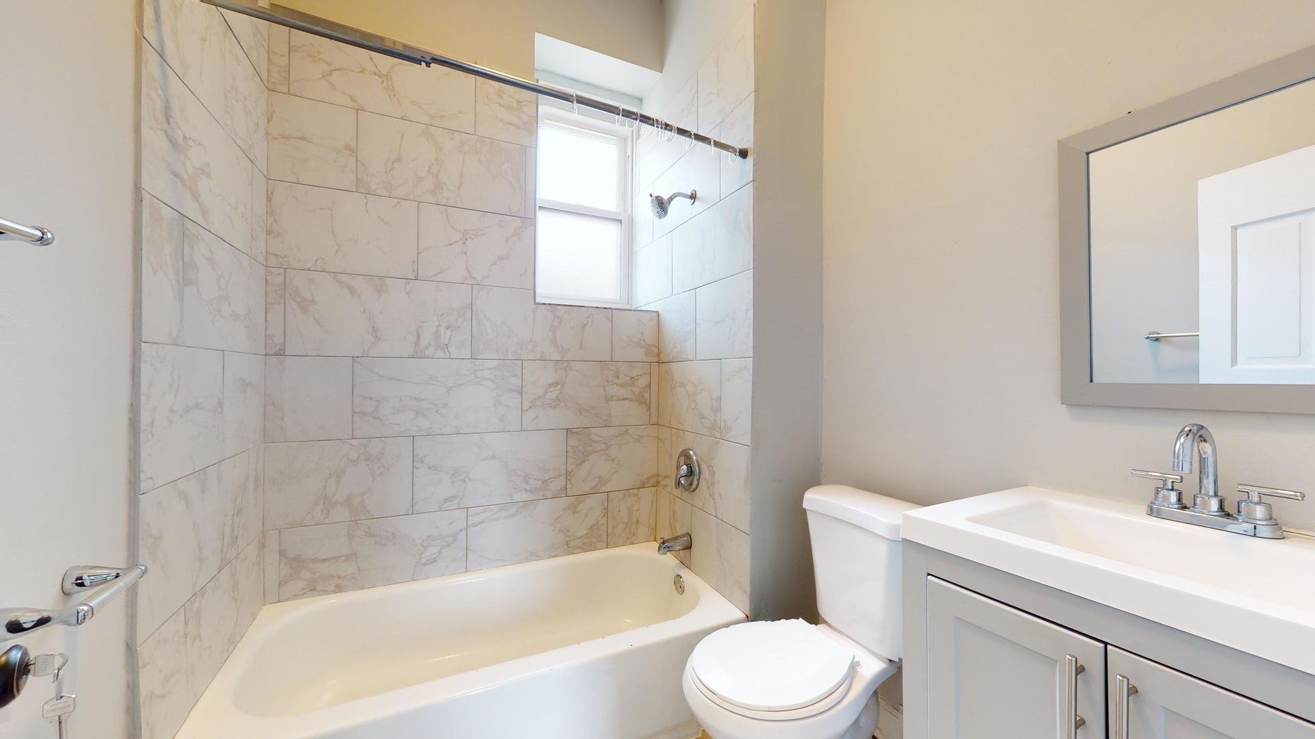 2700 West Cermak Road, Unit 2R Chicago, IL 60608 - Photo 13 of 15 a bathroom with a sink toilet and shower