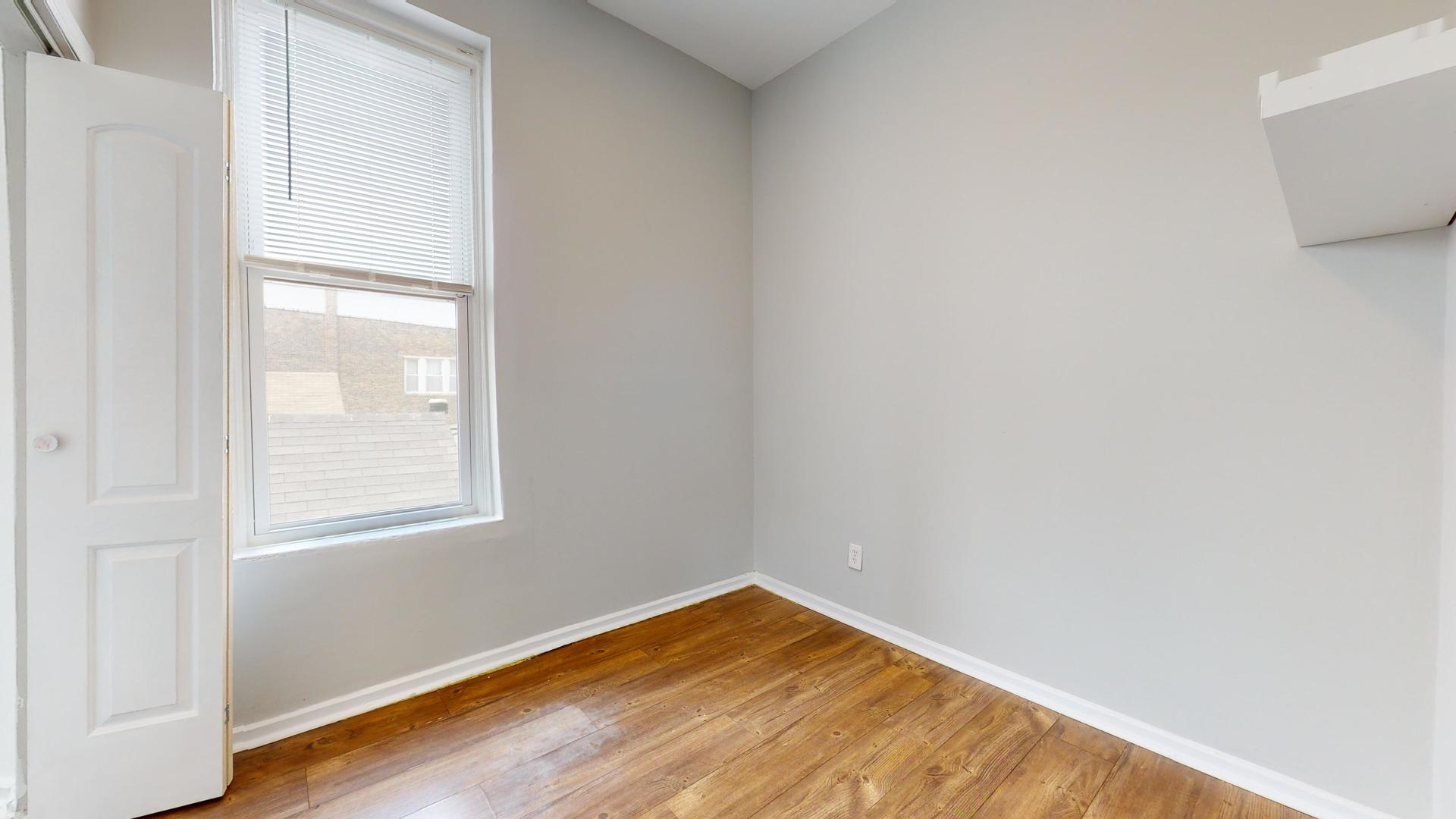 2700 West Cermak Road, Unit 2R Chicago, IL 60608 - Photo 9 of 15 a view of empty room with wooden floor