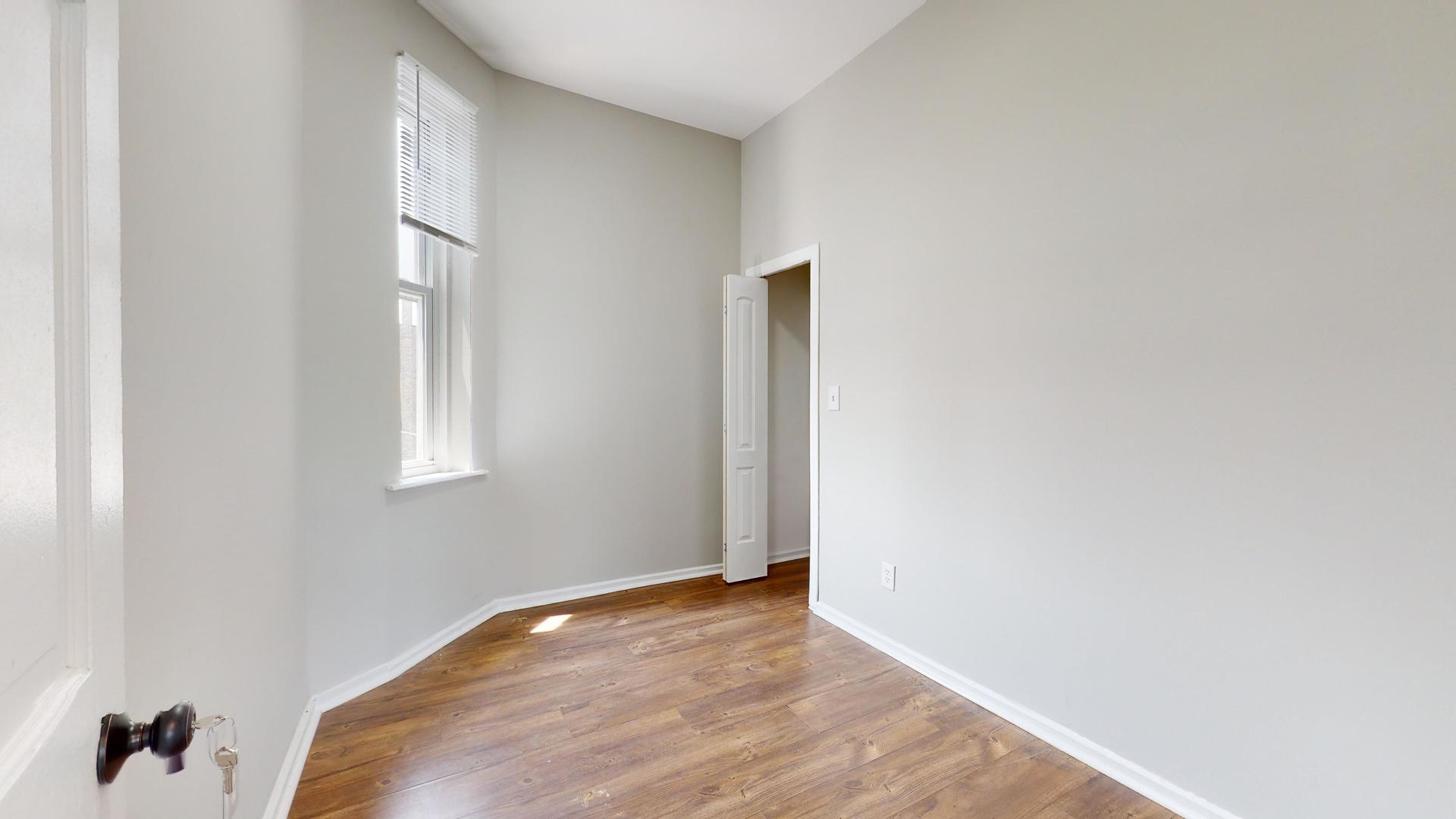 2700 West Cermak Road, Unit 2R Chicago, IL 60608 - Photo 10 of 15 a view of an empty room and window