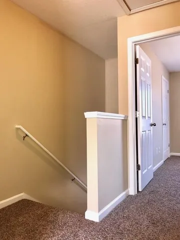 a view of a hallway with closet