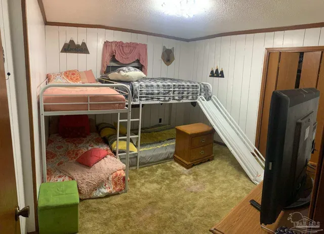 a bedroom with bed and a window