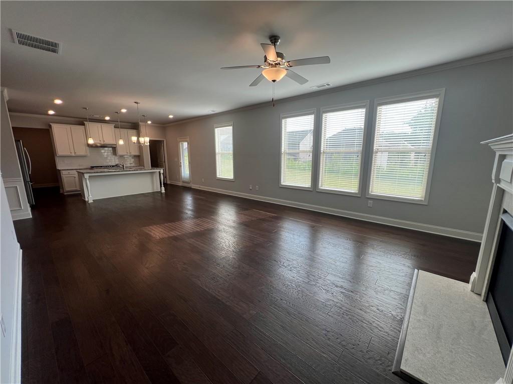 3434 IVY FARM Path Buford, GA 30519 - Photo 11 of 37 a view of an empty room with wooden floor and a window