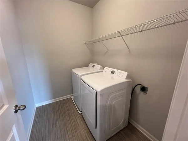 a utility room with a washer dryer and washer