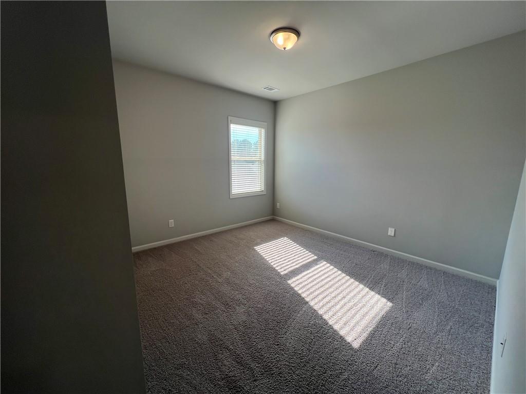 3434 IVY FARM Path Buford, GA 30519 - Photo 20 of 37 an empty room with windows