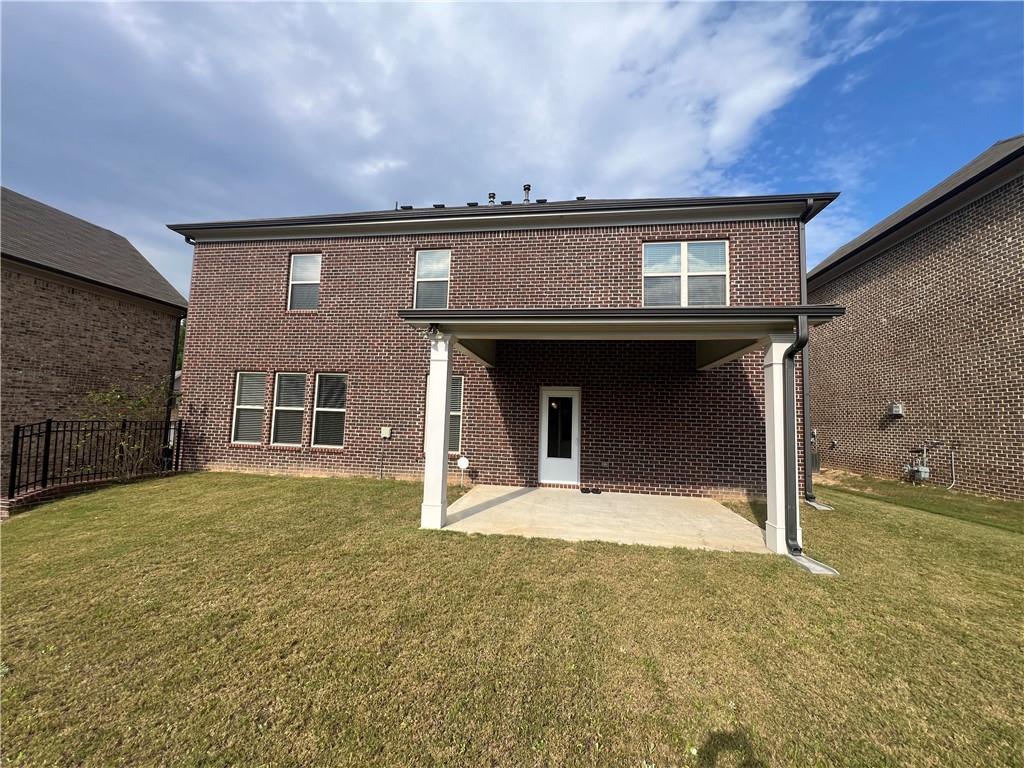 3434 IVY FARM Path Buford, GA 30519 - Photo 2 of 37 a house view with a garden space
