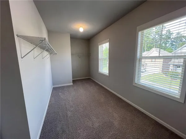 a view of hallway with windows