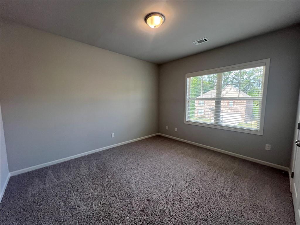 3434 IVY FARM Path Buford, GA 30519 - Photo 36 of 37 an empty room with a window