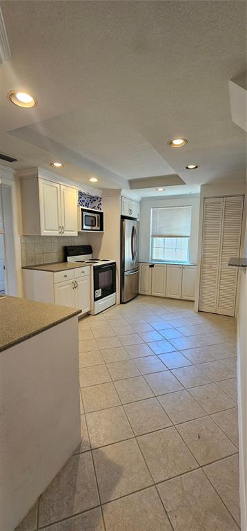 3125 19th Street North St. Petersburg, FL 33713 - Photo 4 of 14 a view of a kitchen with a sink stove cabinets and empty room