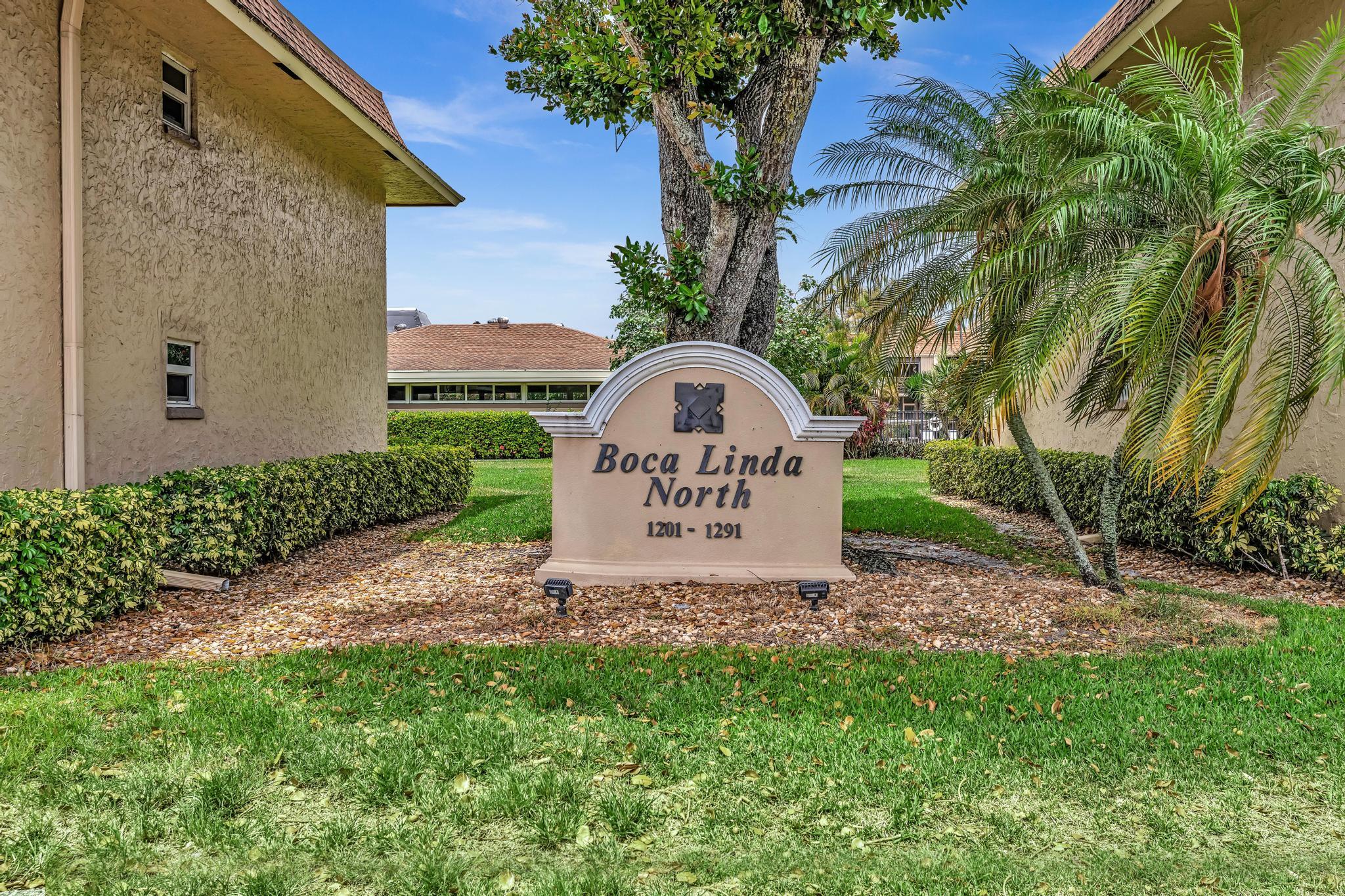 1291 Northwest 13th Street, Unit 445D Boca Raton, FL 33486 - Photo 1 of 50 a view of a back yard of the house