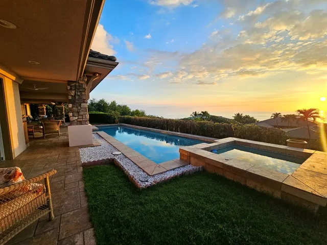 a view of swimming pool with seating space