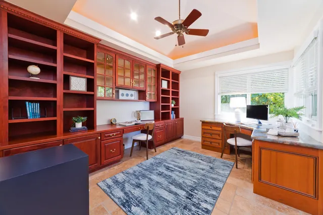a kitchen with a sink cabinets and window