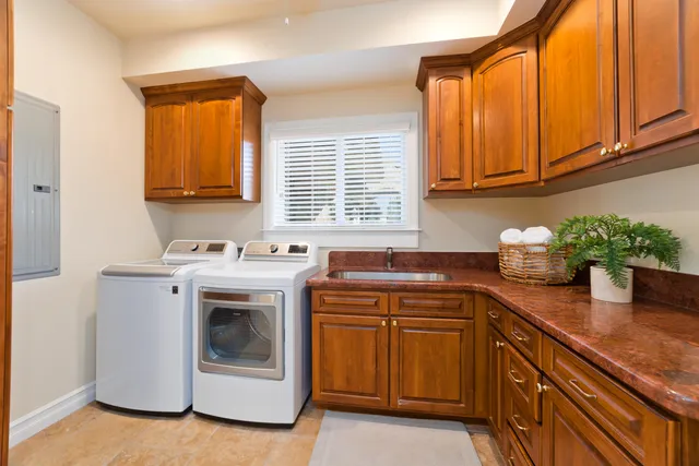 a view of a refrigerator and storage in a room