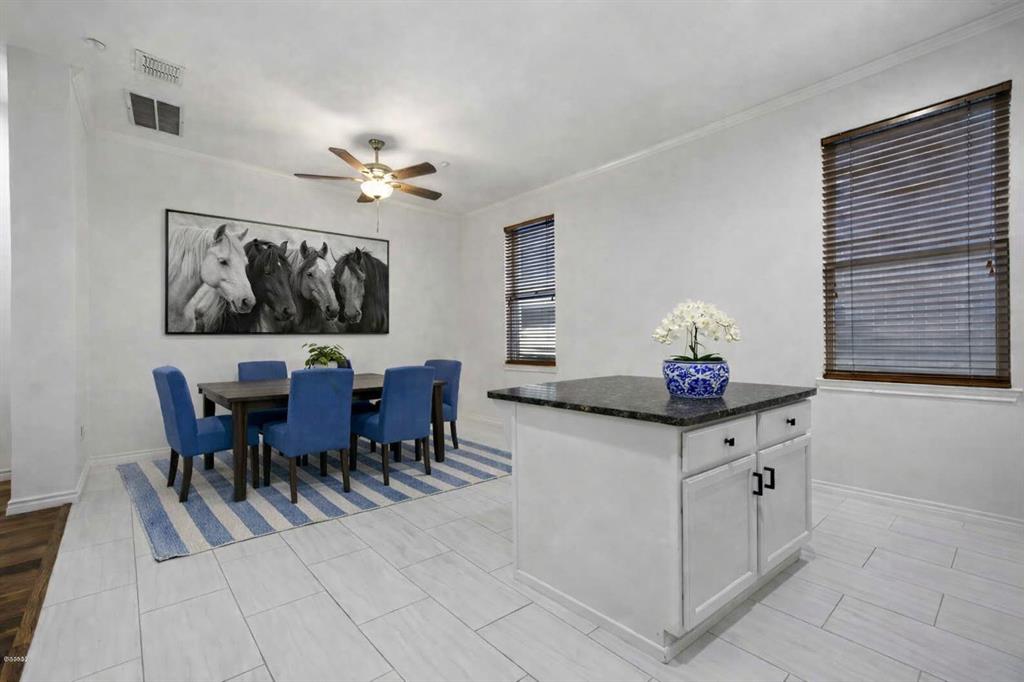 4330 McKinney Avenue, Unit 16 Dallas, TX 75205 - Photo 12 of 34 Virtually staged dining area opens to kitchen.