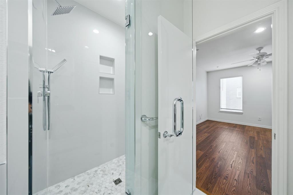 4330 McKinney Avenue, Unit 16 Dallas, TX 75205 - Photo 19 of 34 Large separate shower with marble tile in the primary bathroom.