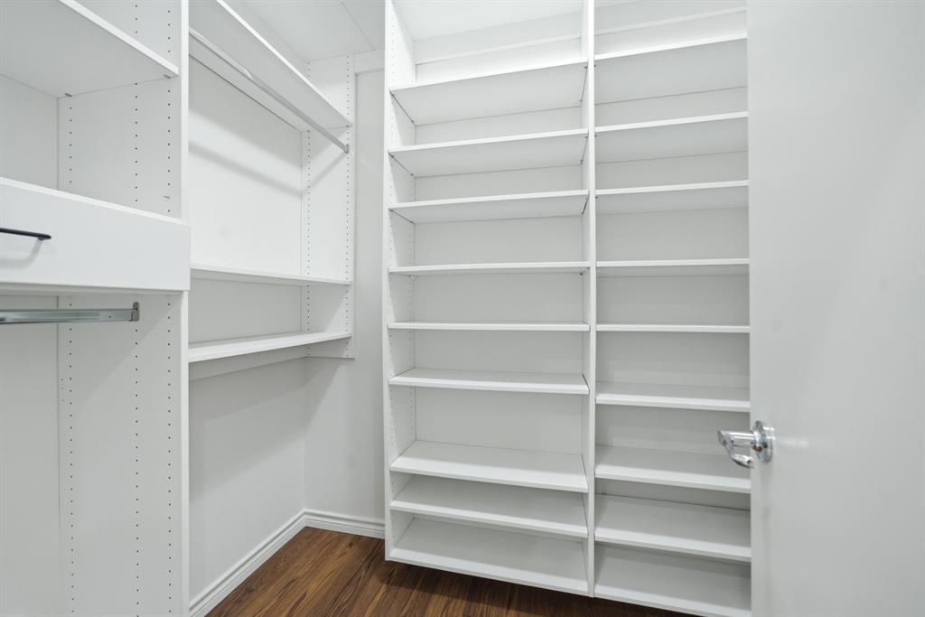 4330 McKinney Avenue, Unit 16 Dallas, TX 75205 - Photo 22 of 34 Loads of shelving make it easy to stay organized in the walk-in closet.