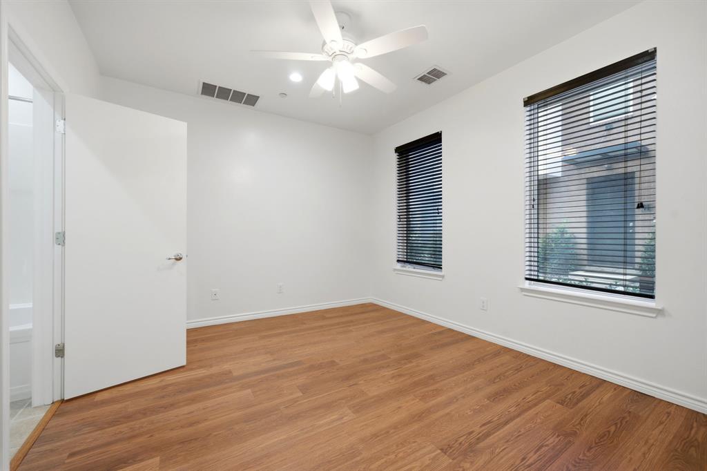 4330 McKinney Avenue, Unit 16 Dallas, TX 75205 - Photo 25 of 34 First floor bedroom with pretty wood floors.