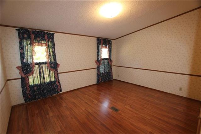 523 Bumpus Mills Road Dover, TN 37058 - Photo 12 of 20 master bedroom, laminate flooring, adjoining bath