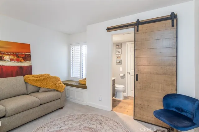 a living room with furniture and a rug