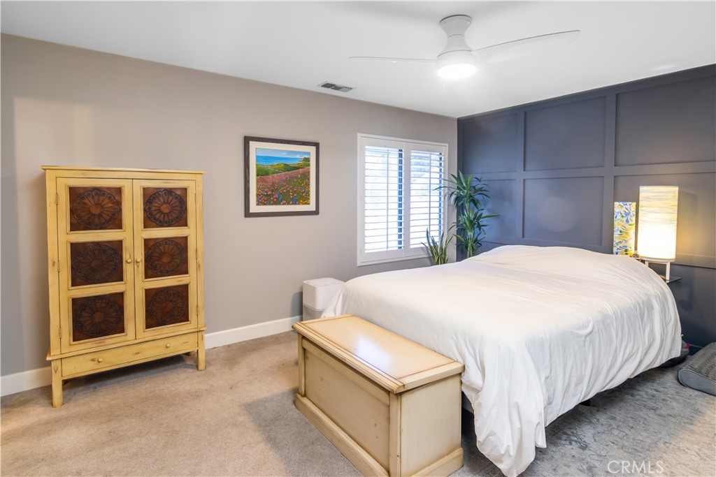 24831 Apple Street, Unit B Newhall, CA 91321 - Photo 18 of 37 a bedroom with a bed and a window